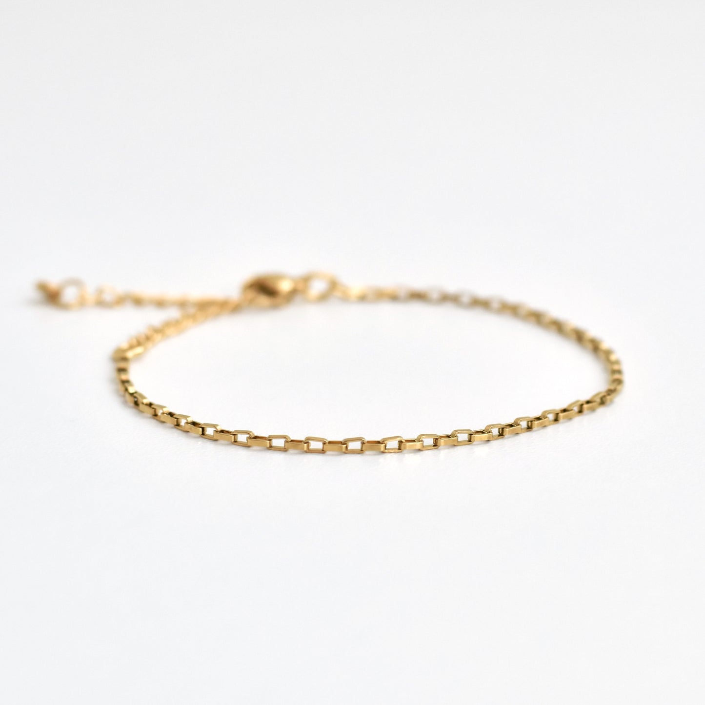 Mini schakel armbandje - goud