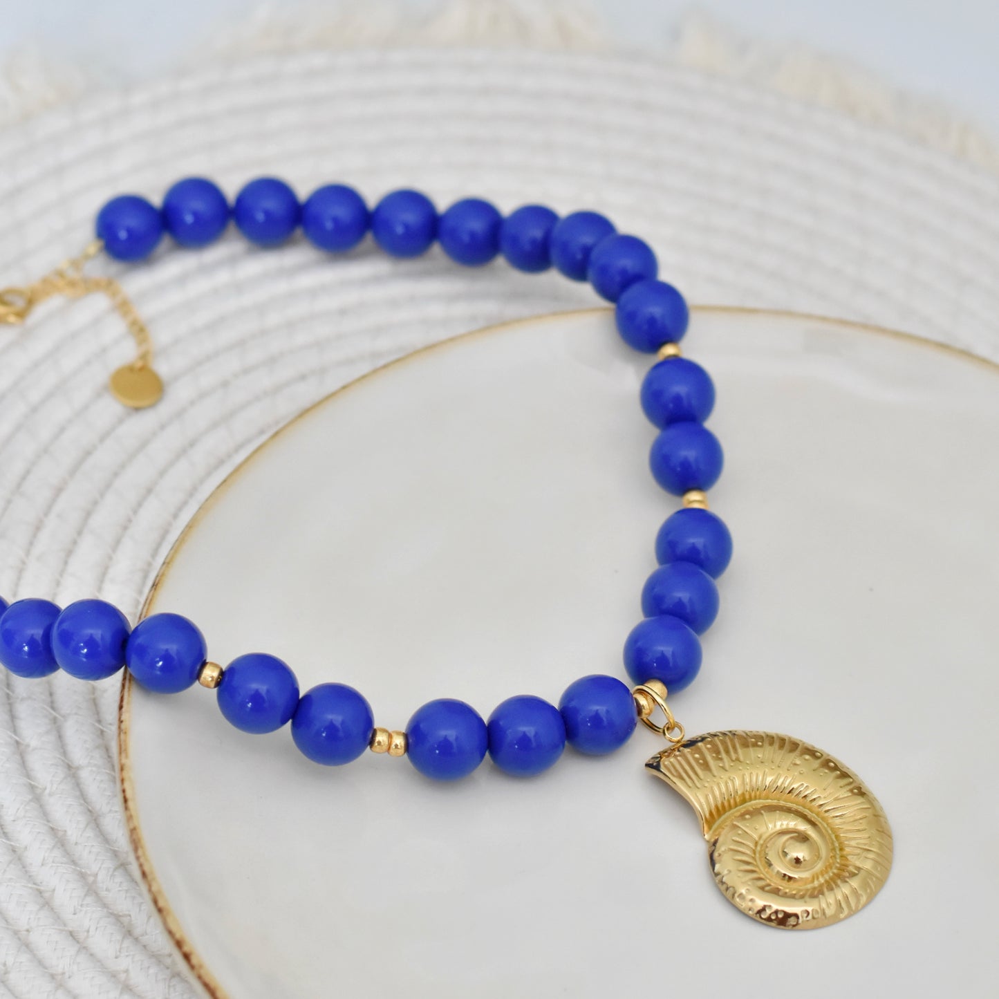 Blauwe kralen ketting met xl schep bedel
