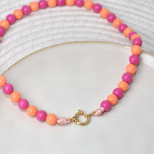 Kralen ketting met boeislot - oranje roze